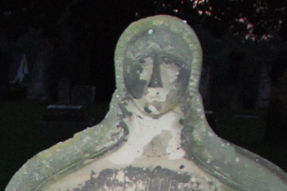 Evangelical St. Marcus Cemetery: face in the stone